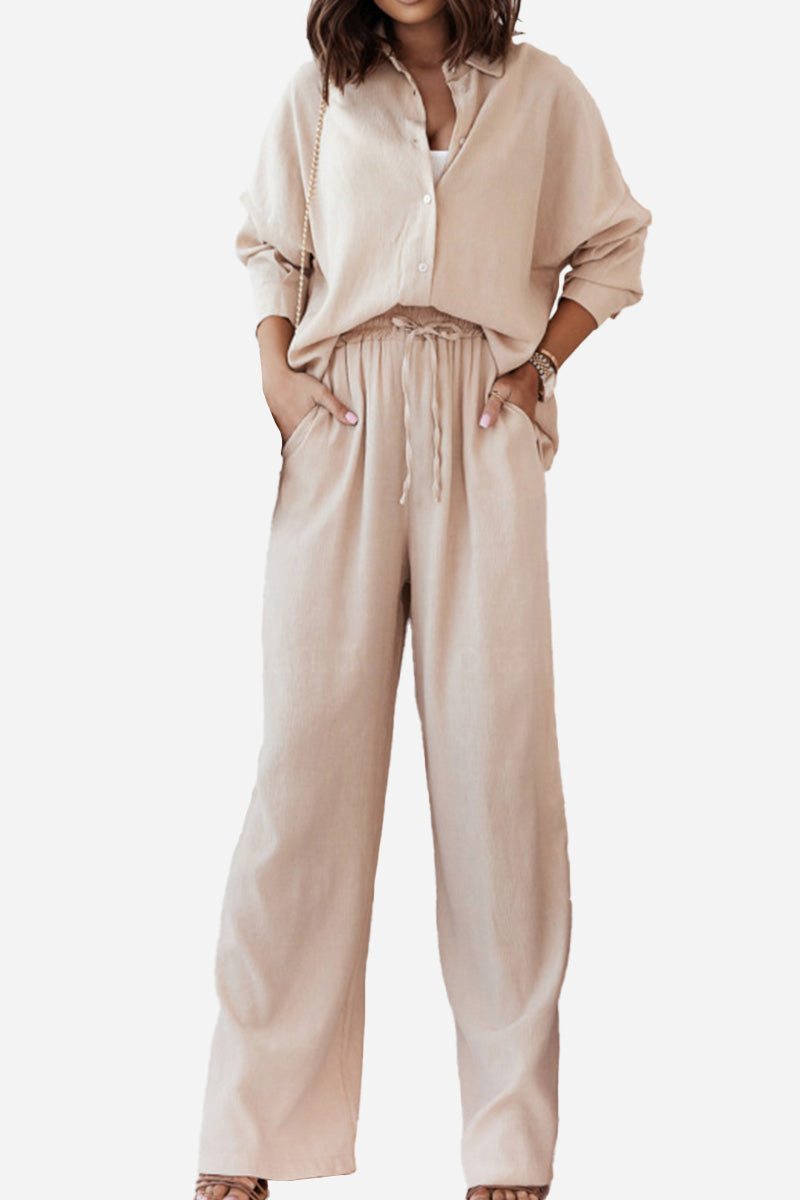 Beige casual two-piece set with loose shirt and wide-leg pants for a relaxed fit and professional look.