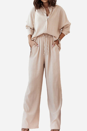 Beige casual two-piece set with loose shirt and wide-leg pants for a relaxed fit and professional look.