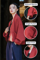 Woman wearing relaxed fit open front ramie linen and cotton cardigan with single pocket in deep red