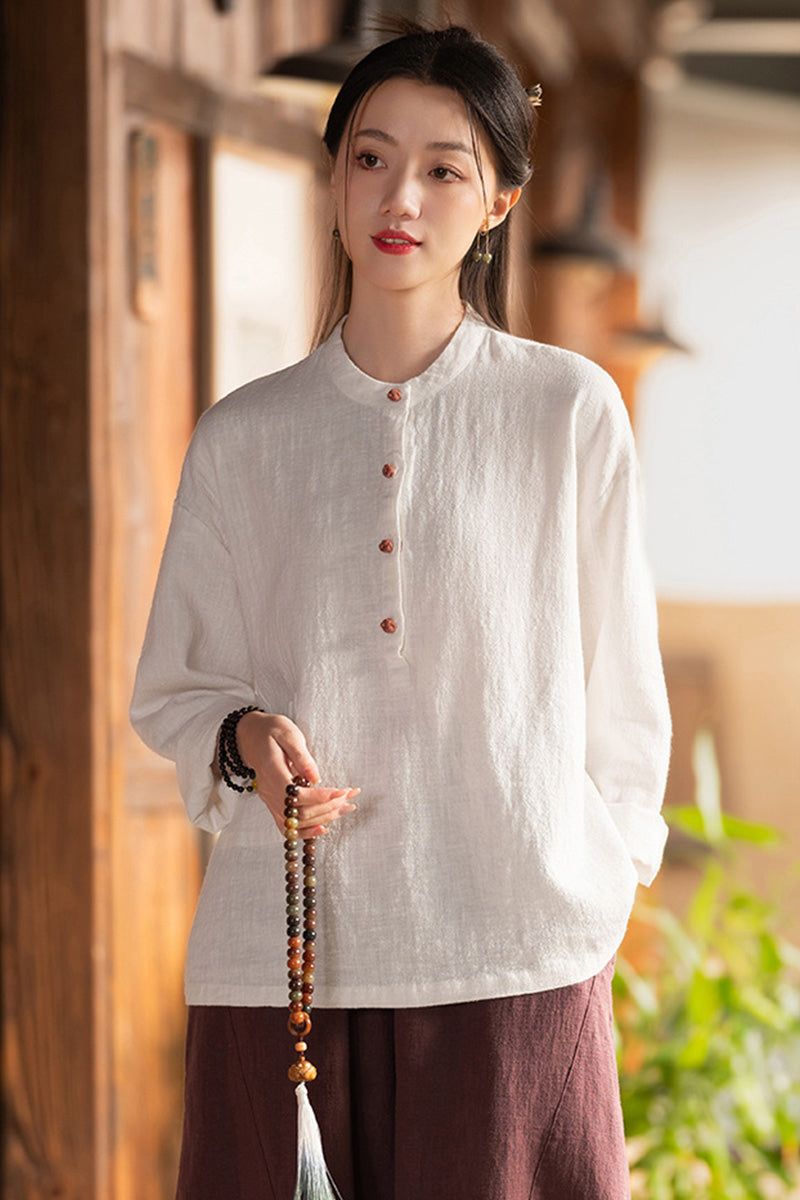 Woman wearing one size ramie linen & cotton blouse with long sleeves and button front, styled casually
