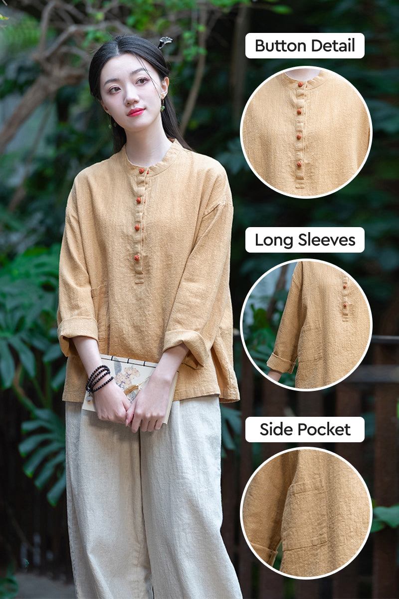 Woman wearing beige ramie linen & cotton blouse with button detail, long sleeves, and side pocket