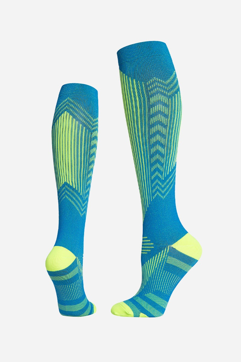 Blue and green premium compression socks with gradual compression design for travel and leg support