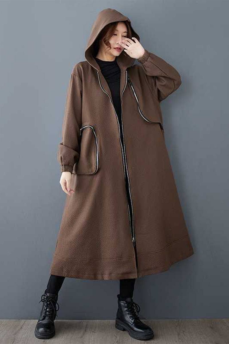 Brown ZipLine Oversized Long Coat with hood and zippered pockets, worn by woman, lightweight and travel-friendly design