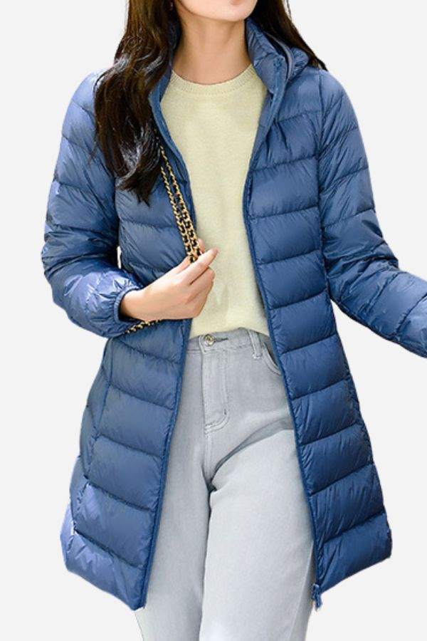 Women’s lightweight blue water-resistant hooded puffer coat for travel and everyday wear