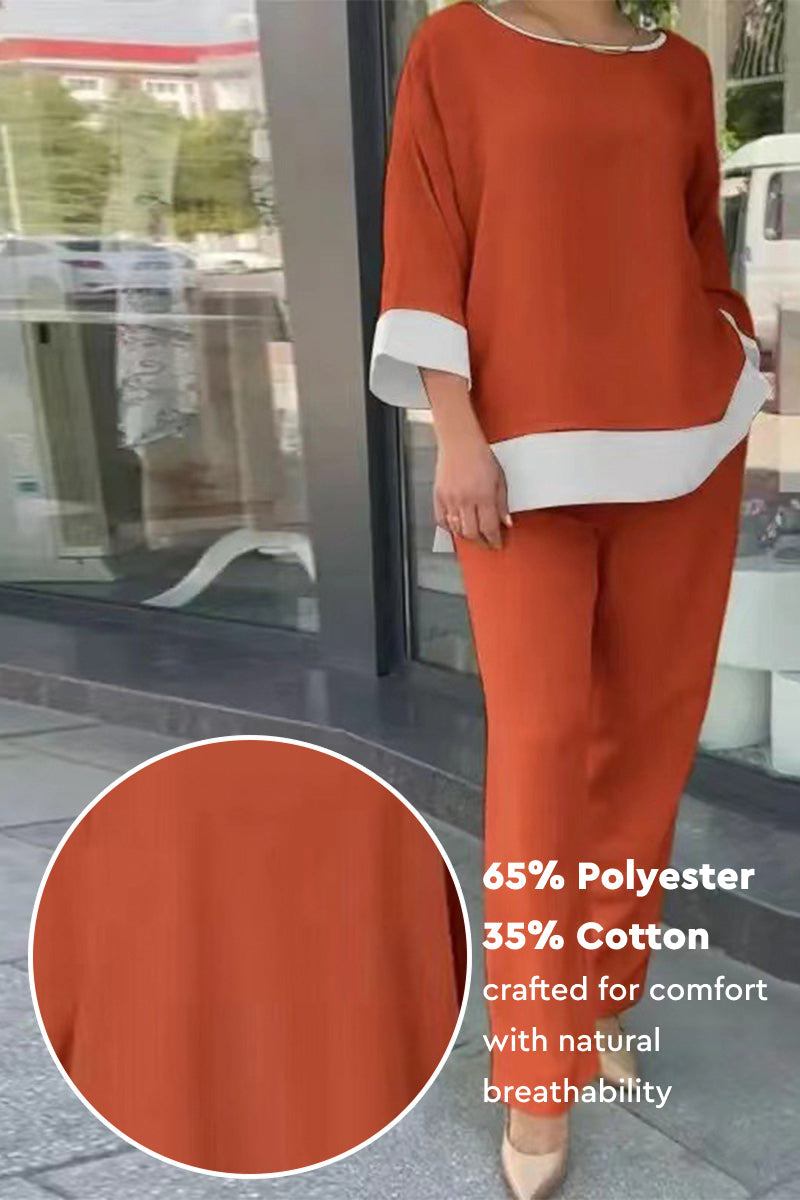 Dual-tone 3/4 sleeve two-piece set in orange with white trim, made of breathable cotton-polyester blend for comfort and style