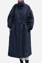 Oversized cotton stain-resistant navy travel coat with button front and lightweight design