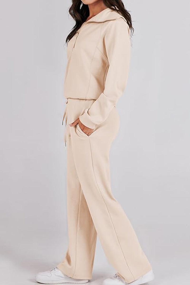 Woman wearing beige Loungewear Buttersoft Tracksuit Set with zip-up hoodie and relaxed fit pants.