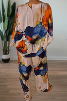 Plus size vibrant floral matching set with flowy silhouette and colorful large flower patterns