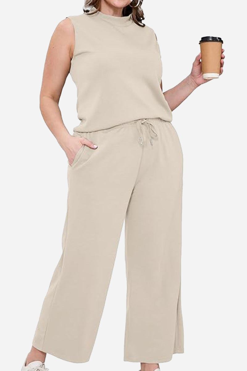 Woman wearing beige Cotton Chic Sleeveless two-piece set holding coffee cup