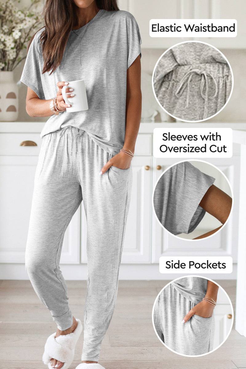 Woman wearing ultra-soft two-piece loungewear set in gray with elastic waistband, oversized cut sleeves, and side pockets