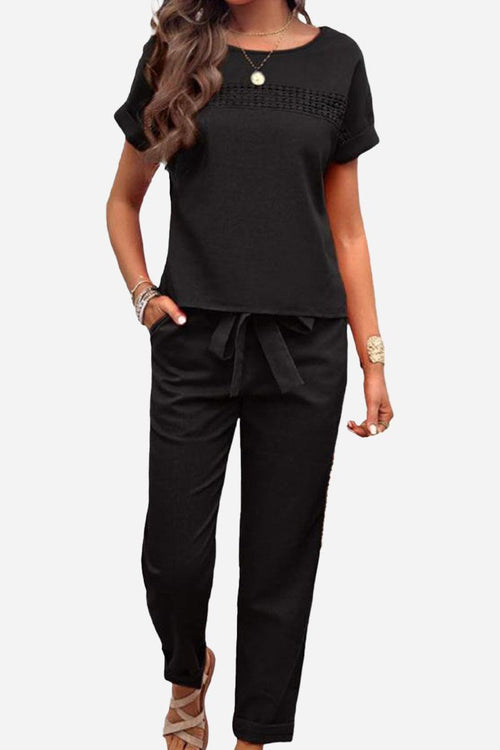 Women's black 100% cotton Total Comfort Two-Piece Set with short sleeve top and drawstring pants for travel and casual wear.