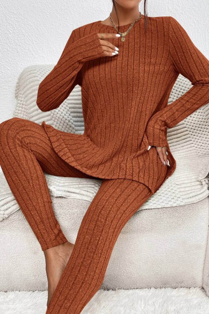 Woman wearing rust-colored Butter Touch Ribbed Two-Piece Set with long sleeve top and matching ribbed pants sitting on a beige couch