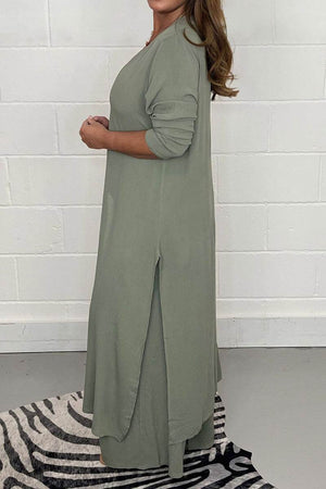 Side view of woman wearing sage green Urban Chic V-Neck Split Top two-piece set with long sleeves and side slit