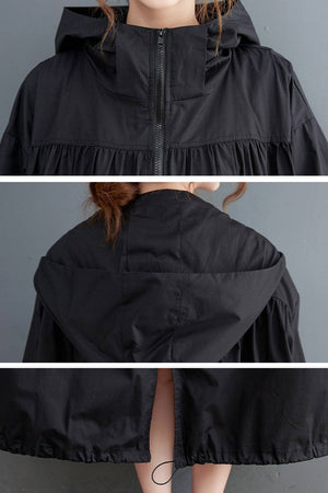 black oversized all-weather water-resistant windbreaker with hood and front zipper closure