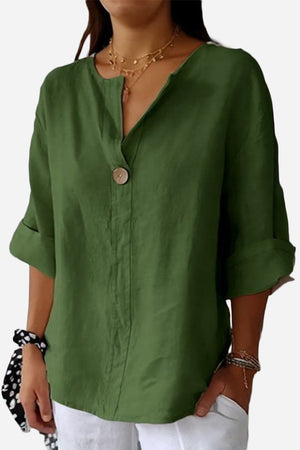 Green pure linen age-defying shirt with button detail and rolled sleeves on model