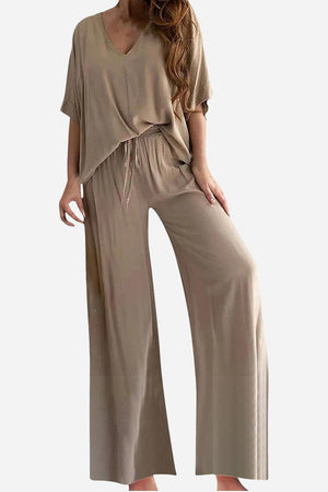 Taupe two-piece pantsuit with V-neck top and wide-leg pants, comfortable stretch fabric for a flattering fit.