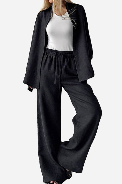 black 100 cotton wanderlust two-piece set with loose pants and blazer jacket on woman wearing white top