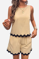 Flattering Coastal Scallop two-piece set in soft beige viscose with black scalloped hem, sleeveless top and matching shorts for comfortable, stylish summer wear
