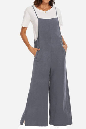 Woman wearing a breathable gray cotton blend comfort jumpsuit with wide legs and pockets over a white t-shirt