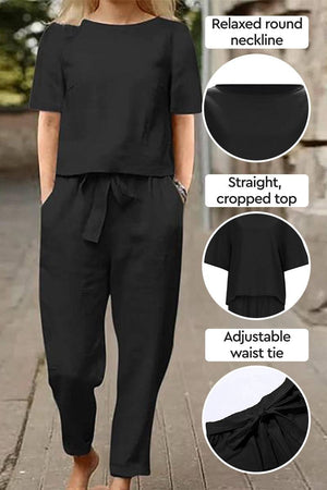 Black cotton-linen blend two-piece set with relaxed round neckline, cropped top, and adjustable waist tie