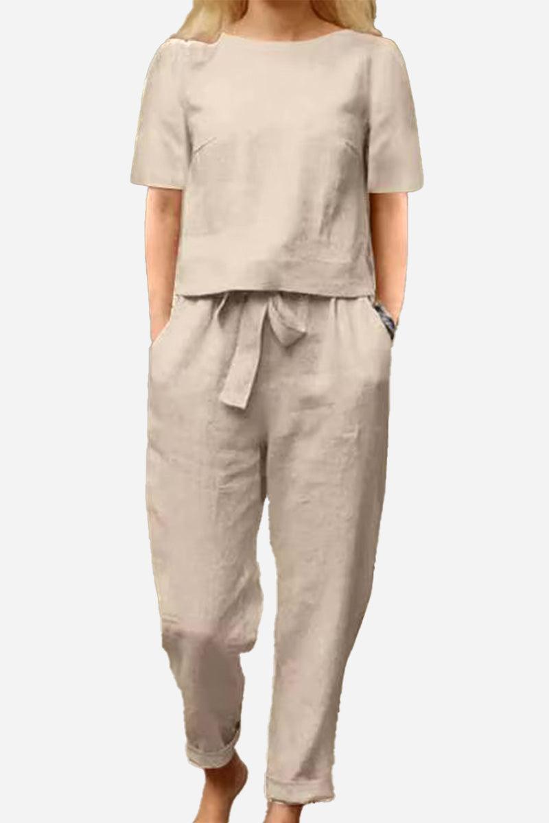 Beige cotton-linen blend two-piece set with short-sleeve top and relaxed fit pants, breathable and soft fabric.
