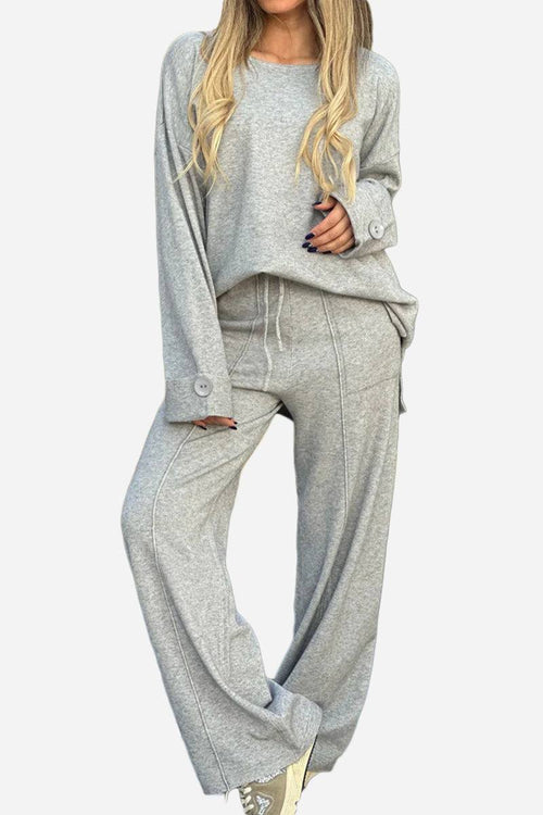 Women's comfortable grey travel-ready two-piece set with relaxed fit sweater and wide-leg pants