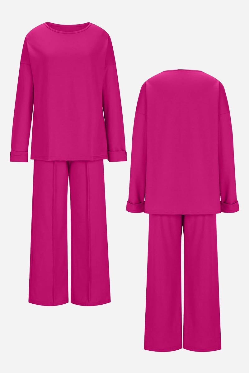 Bright pink comfortable travel-ready two-piece set with relaxed fit long sleeve top and wide-leg pants shown from front and back