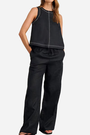Woman wearing black Cotton-Linen Relaxed Back-Slit Two-Piece Set with sleeveless top and wide-leg pants