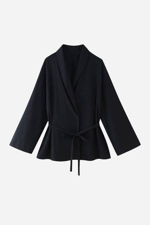 Black wide-leg pants and matching wrap top mix-match lounge-to-travel set for versatile stylish comfort.