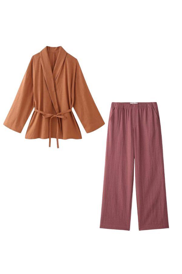 Women's mix-match lounge-to-travel set with rust orange wrap top and dusty rose wide-leg pants