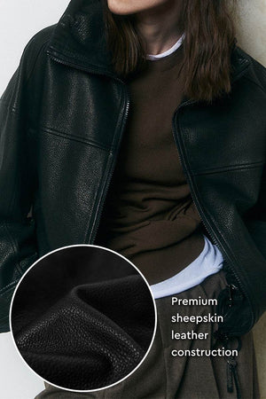 Black sheepskin leather jacket with premium soft leather construction and zipper closure