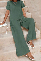 Riviera Relaxed Two Piece Set in soft green polyester with wide-leg pants and short-sleeve top, perfect for comfortable travel and casual elegance.
