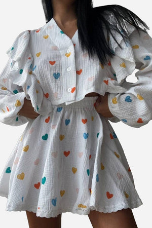Sweet Countryside 100% cotton white two-piece set with colorful heart prints and ruffled sleeves.