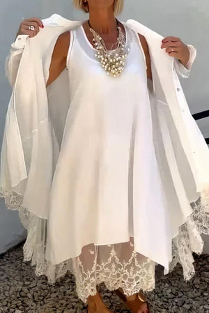 Woman wearing Villa Breeze Dress and Cardigan Set in white with lace details and layered necklace