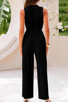 Woman wearing black Stroll & Hangout Ribbed Knit two-piece set with sleeveless top and wide-leg pants, back view