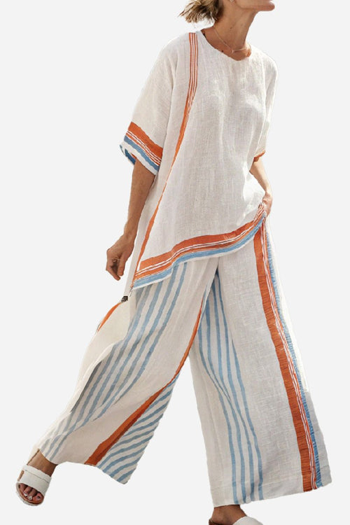 Santorini Sunset Striped two-piece set with loose fit, breathable fabric, and vibrant orange and blue stripes.