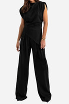 Black Manhattan Lines Draped sleeveless two-piece set with asymmetrical top and wide-leg pants
