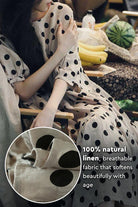 Cottage Garden 100% linen dress with black polka dots, breathable natural fabric, relaxed Japanese-inspired tiered design.