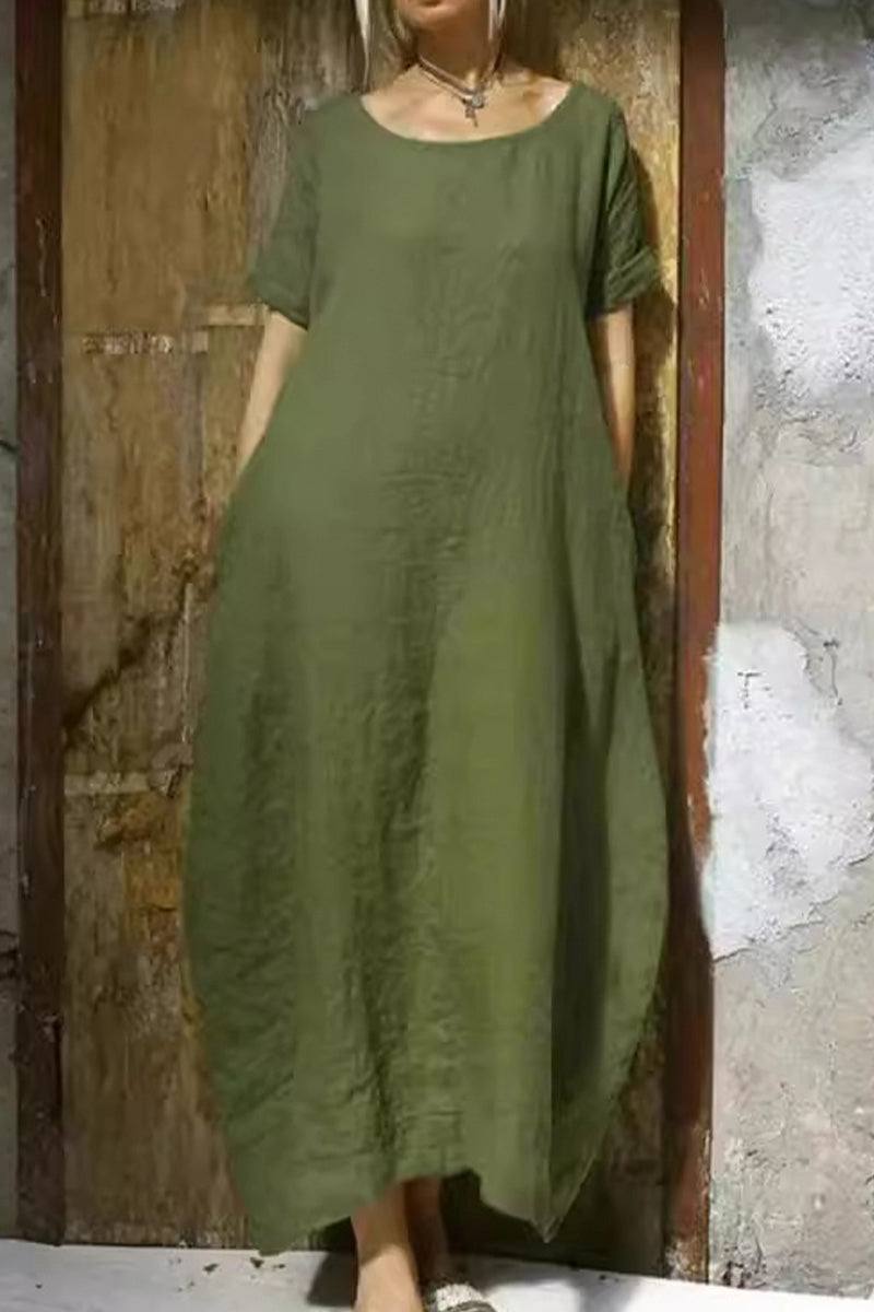 Olive green Breeze Cocoon Dress with relaxed fit, rolled sleeves, and deep side pockets in breathable linen-like fabric.