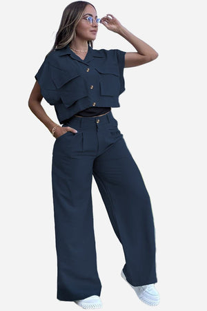 Woman wearing navy blue two-piece big pocket cargo set with cropped top and wide-leg pants