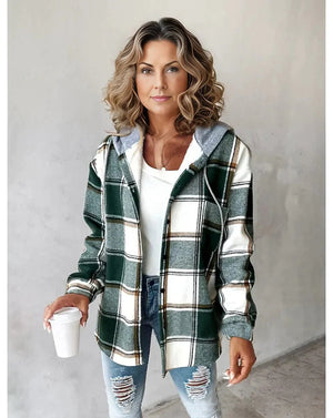 Woman wearing Highland Plaid Shacket with green and white plaid pattern, soft fleece lining, attached hood, and button-front closure.