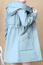 Light blue Cityscape Comfort Hooded Windbreaker jacket with plush lining and hood for cozy cold-weather wear