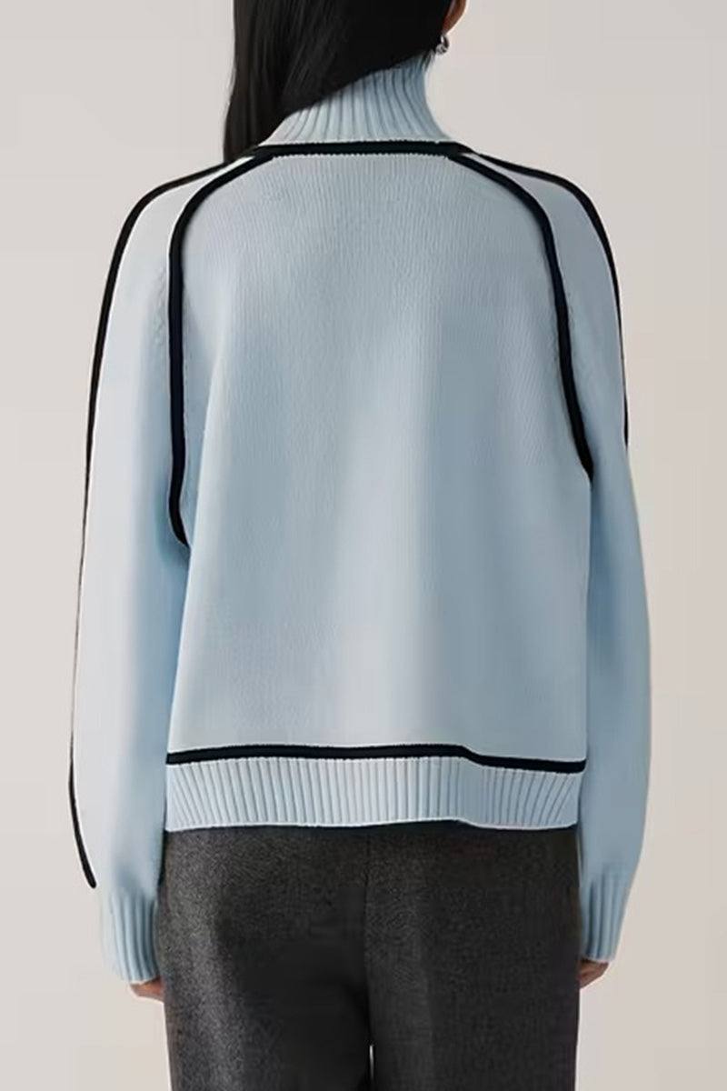 Back view of light blue Zero Itch turtleneck sweater with black contrast trim and relaxed fit.