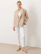 Modern double-breasted blazer with raw-edge seaming and cotton-blend fabric for comfort and style