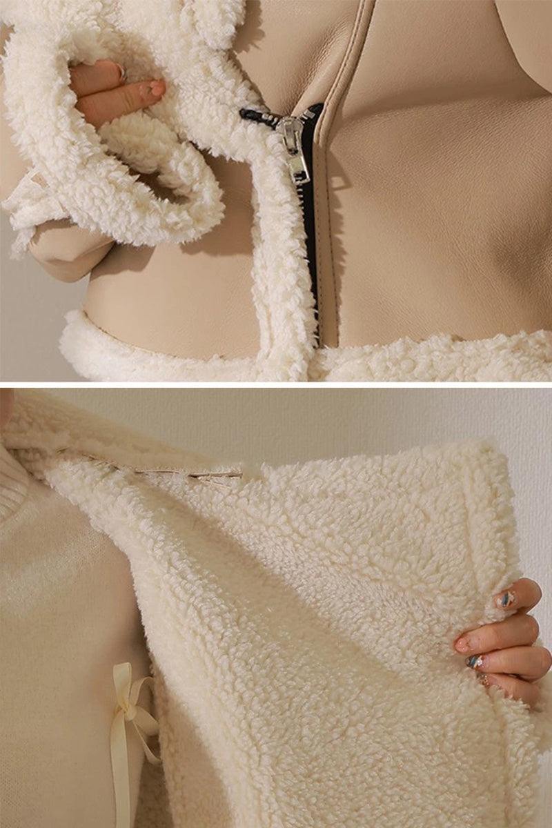 Cropped faux leather sherpa jacket with cream sherpa lining and trim, soft matte finish, and front zipper closure.