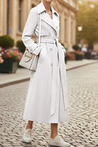 Elegant full-length timeless retro belted trench coat in soft structured fabric with double-breasted design and wide lapels.