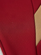 Woman wearing Colorblock Comfort Tracksuit with contrast curved panels and relaxed fit