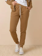 Woman wearing colorblock comfort tracksuit with contrast curved panels and relaxed fit