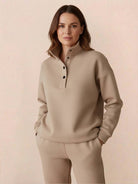 Woman wearing beige Warm & Easy Two-Piece Set with button-collar pullover and matching relaxed-fit pants