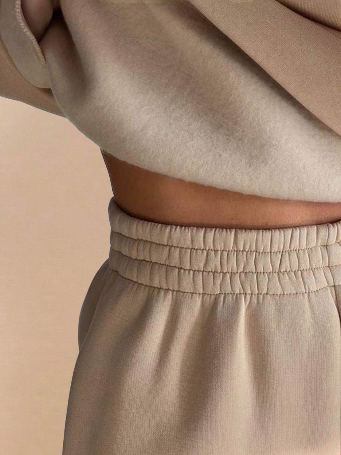 Close-up of beige warm and easy two-piece set with elastic waistband and soft brushed fabric
